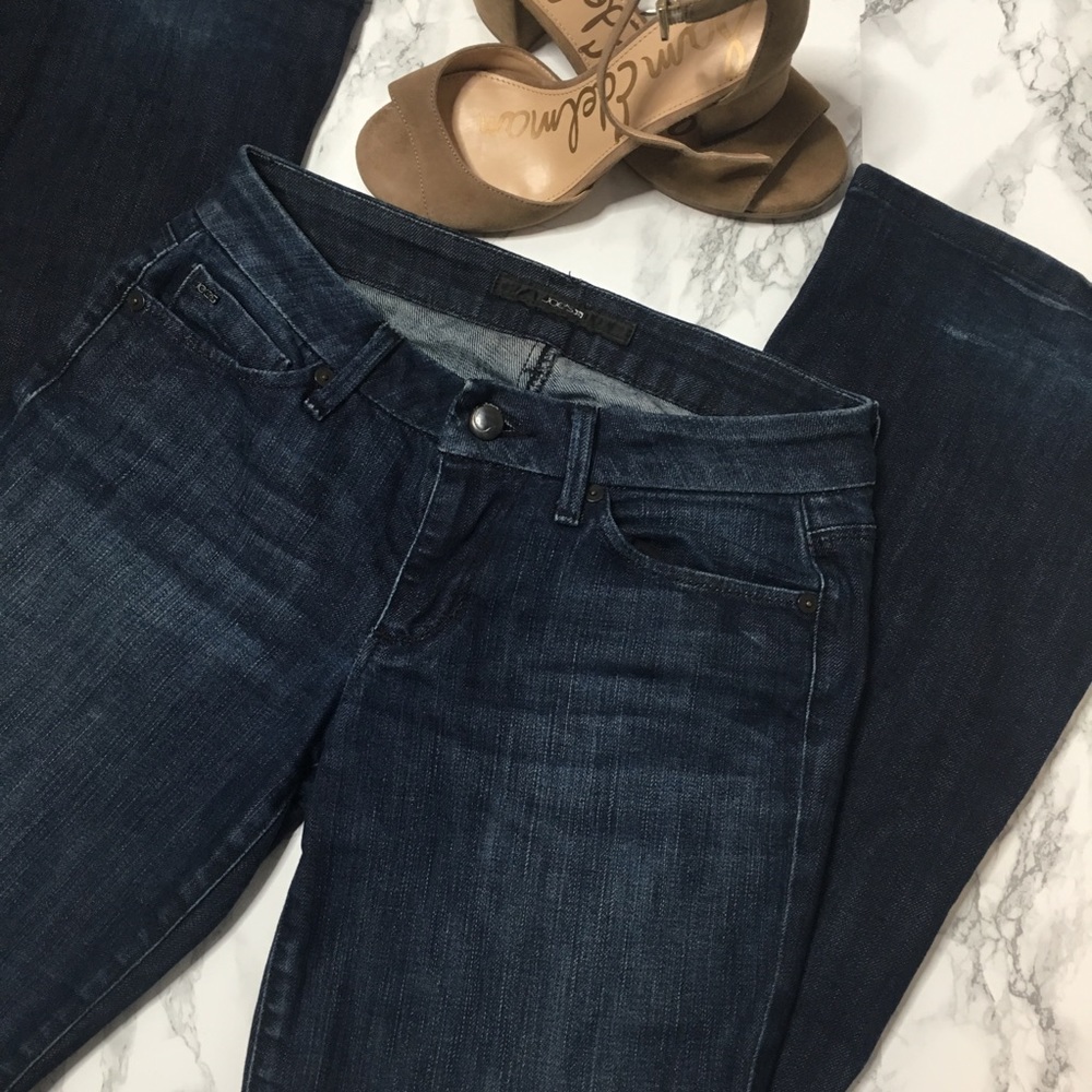 Joe’s Jeans dark wash with detailed pockets.